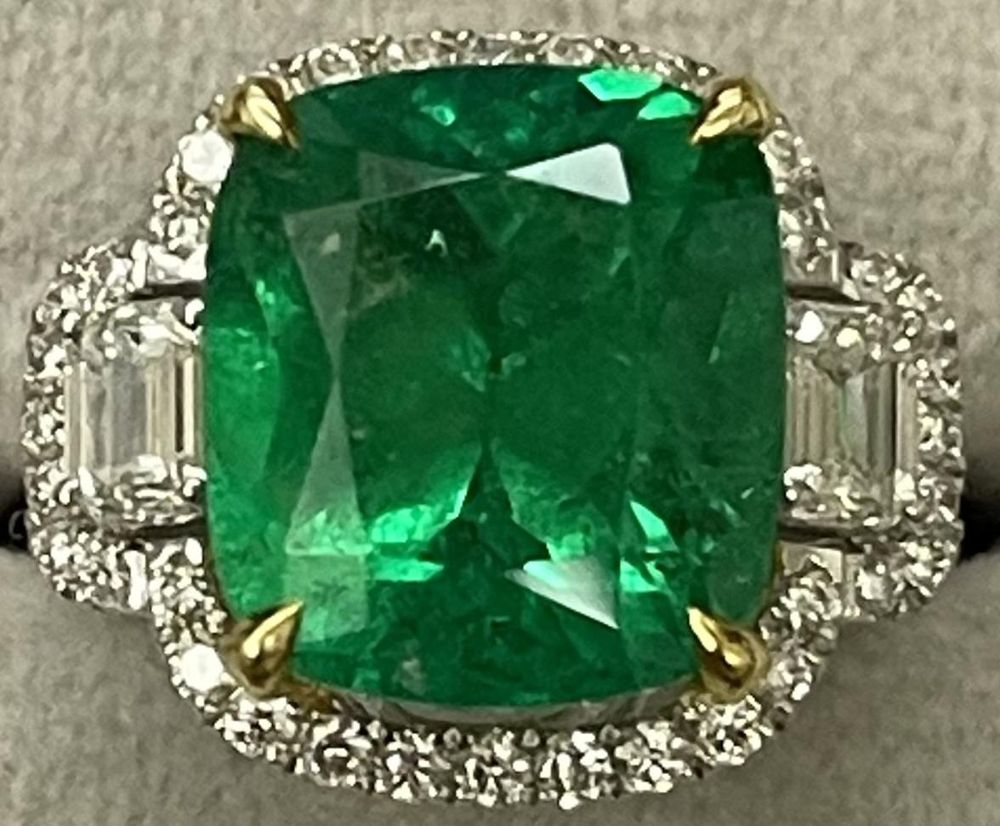 Emerald ring set with diamonds